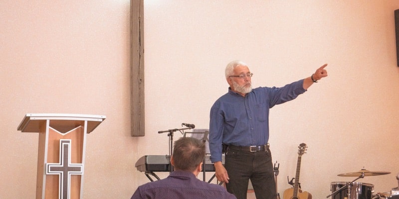 A Protestant priest speaks in front of the faithful.