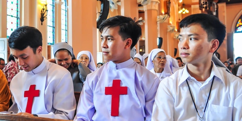 Catholic priests attend mass at the Cathedral of the Immaculate Conception, in Thailand.