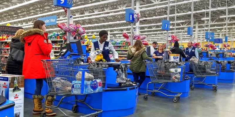 Buyers purchase goods in a supermarket.