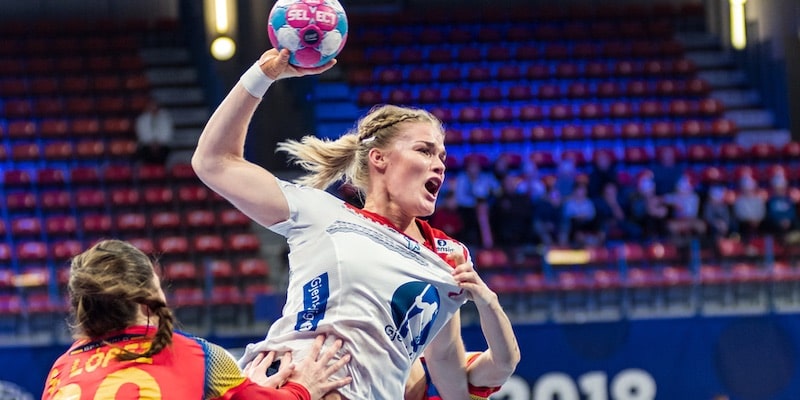 Handball player Veronica Kristiansen prepares to score.