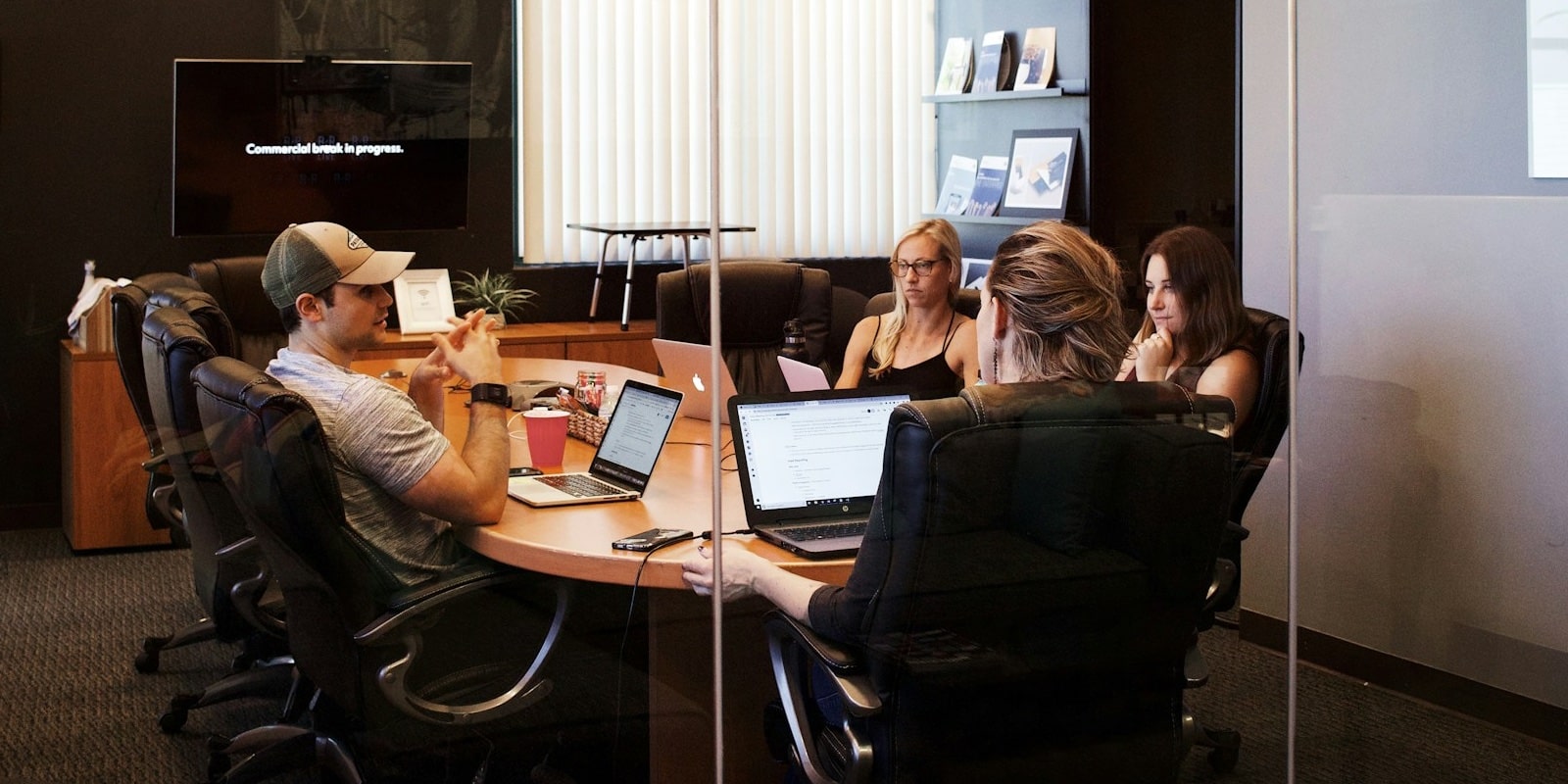 a group of workers meets in an office