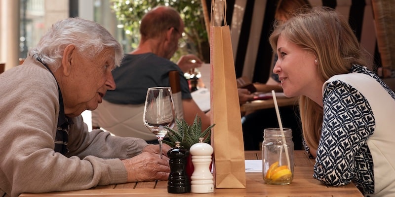 two people talk in a cafe