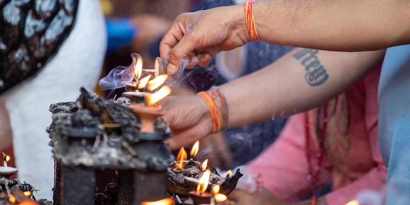 Nepalese people light candles following popular tradition.