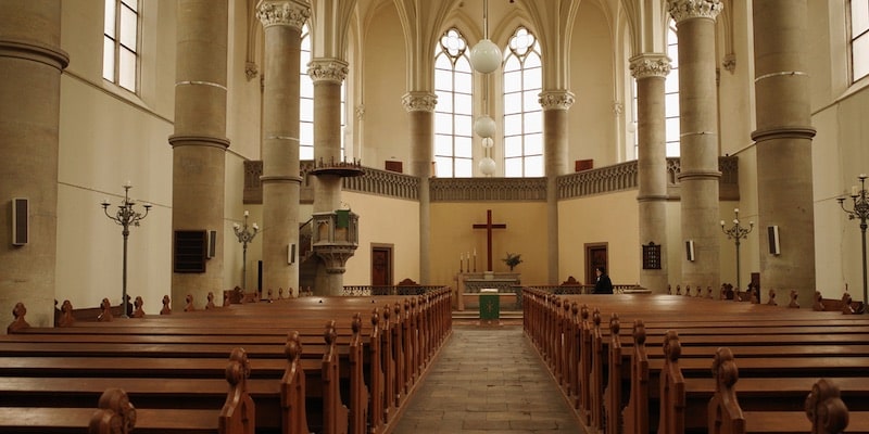 A Protestant church with a cross behind the altar.